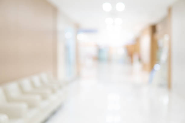 istock Abstract blur luxury hospital corridor. Blur clinic interior background with defocused effect. Healthcare and medical concept 1073154998