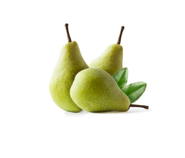 istock Ripe pears with leaves isolated on a white background. Three pears with copy space for text. Green pears close-up. Pear on white background. 1073158946