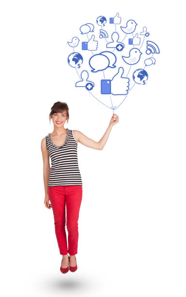 istock Happy lady holding social icon balloon 1073158976