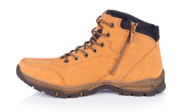 istock One brown leather hiking boot or shoe isolated on white background. 1073160462