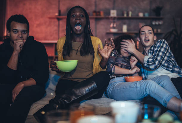 istock Friends watching a scary movie 1073168094