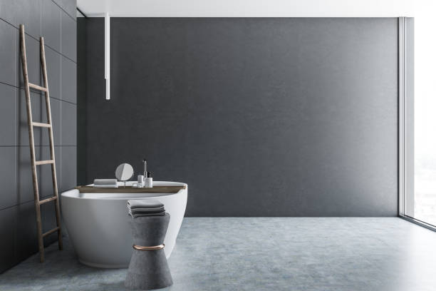 istock Gray tile bathroom, tub and ladder side view 1073171506