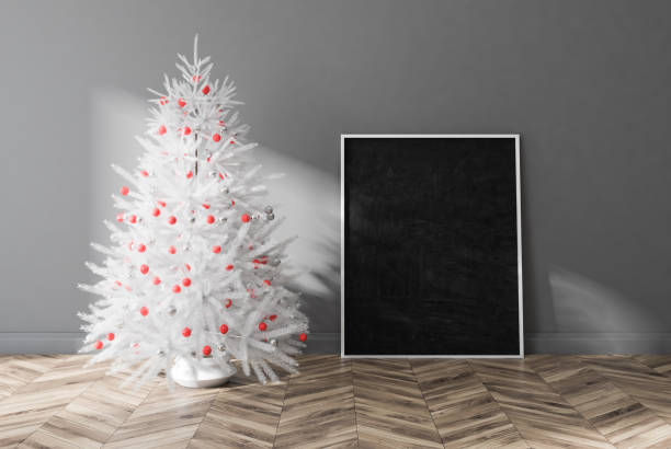 istock White decorated fir tree in gray room, poster 1073171536