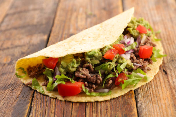 istock traditional taco with minced beef, avocado and salad 1073173528