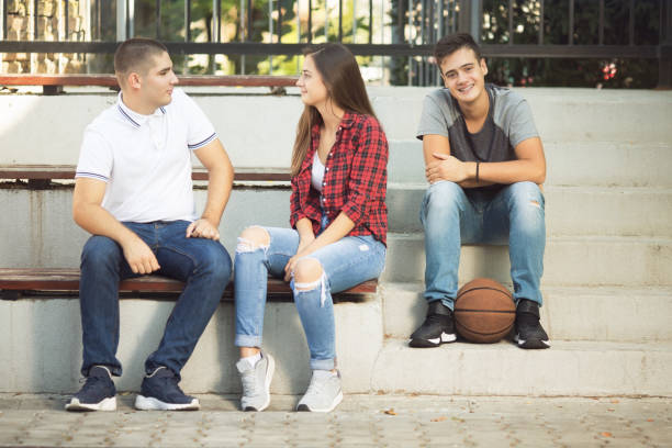 istock Three teenagers having fun after school 1073175100
