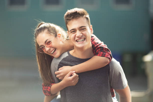 istock Two teenagers laughing 1073184732
