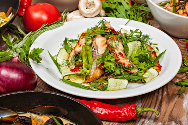 Fish salad with vegetables and herbs.