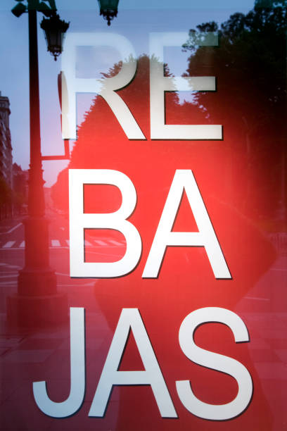 istock Sales sign in spanish language on a shop window. 1073186348