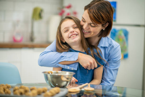 istock Mom hugging daughter 1073189500