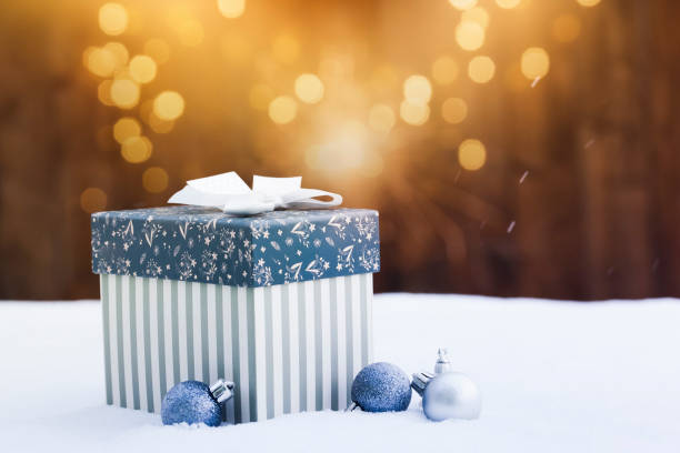 istock gift box in snow - christmas lights 1073192920