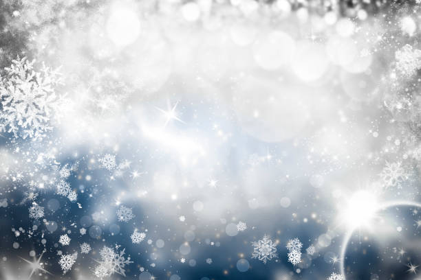 istock abstract Christmas background with holiday lights and copy space - magic bokeh glitter with blinking stars and falling snowflakes 1073194198