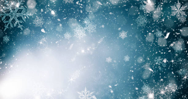 istock abstract Christmas background with holiday lights and copy space - magic bokeh glitter with blinking stars and falling snowflakes 1073194250