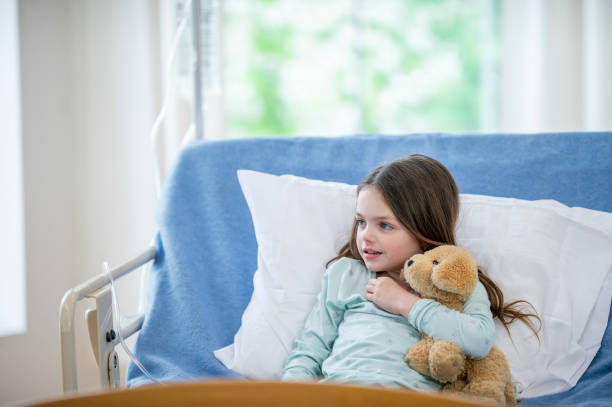 istock Little girl hugging bear 1073199736
