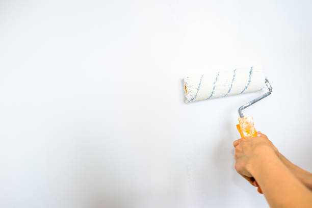 istock Hand painting wall, home renovation concept 1073201202