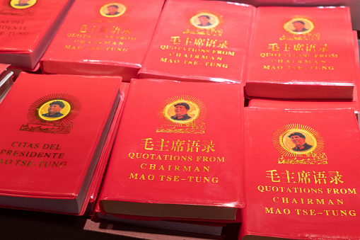 Rows of Chairman Mao's Little Red Book for sale at a market in China.  This book contains statements from speeches and writings of the former Chairman of the Communist Party, and is widely available throughout the country.