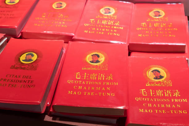 Little Red Book of Quotations from Chairman Mao Tse-tung Rows of Chairman Mao's Little Red Book for sale at a market in China.  This book contains statements from speeches and writings of the former Chairman of the Communist Party, and is widely available throughout the country. book title stock pictures, royalty-free photos & images