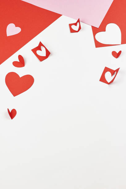 Red and pink paper hearts on white background Valentine's day, love, wedding concept. Copy space, flat lay, template. book heart shape valentines day copy space stock pictures, royalty-free photos & images