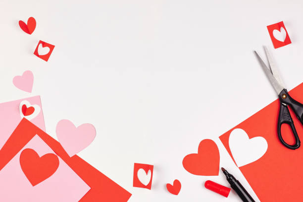 istock Red and pink paper hearts on white background 1073204714