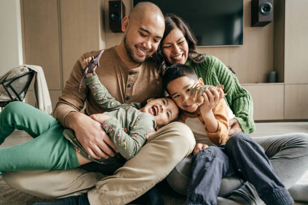 Best part of being at home Family having fun happy filipino family stock pictures, royalty-free photos & images