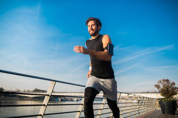 istock Fit man running outdoors 1073209402