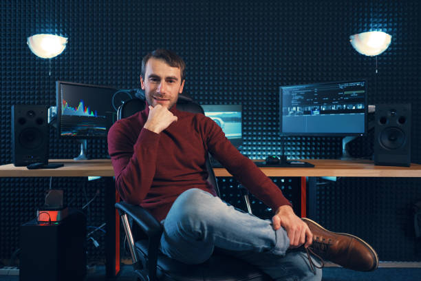istock Successful designer or editor sitting leg over leg in a leather 1073209602