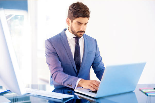 istock Executive young investment advisor portrait while sitting in the office 1073211450