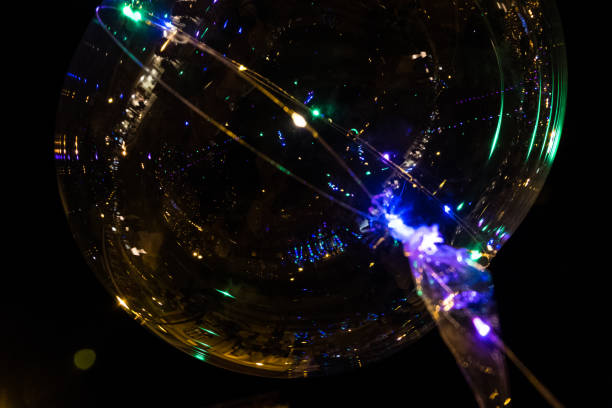 istock LED transparent balloon with illuminated garlands shinning. 1073212752