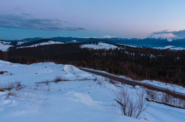 istock Evening twilight winter mountain ridge panorama 1073212960