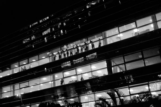 istock People watching the street from a modern building. 1073213416