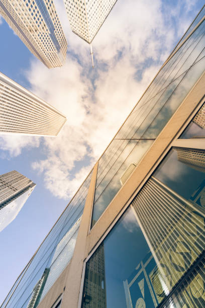istock Filtered image low angle view of skyscrapers with sunny cloud sky in downtown Chicago 1073214002