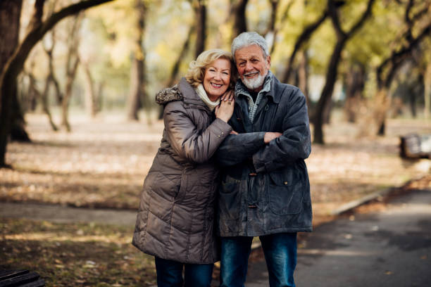 istock Happy romantic senior couple in a park 1073216402