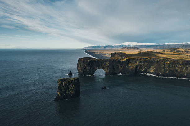Scenic aerial  view of Dyrholaey arch in Iceland Scenic aerial view of black sand beach in Dyrholaey, Iceland golden circle route photos stock pictures, royalty-free photos & images