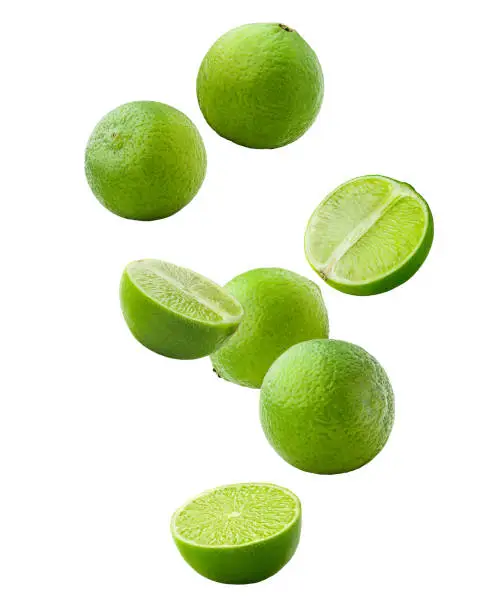 Photo of Falling lime isolated on white background, clipping path, full depth of field