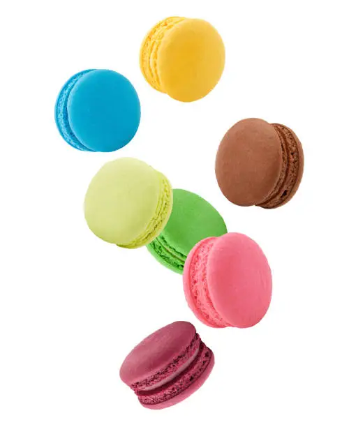 Photo of Falling macaroons isolated on white background, clipping path, full depth of field