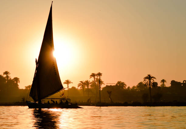 istock Sail boat in an orange sky 1073217848