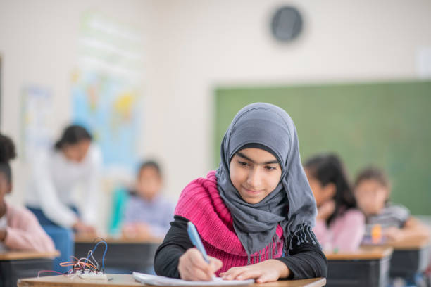istock Muslim girl working on an assignment 1073217992