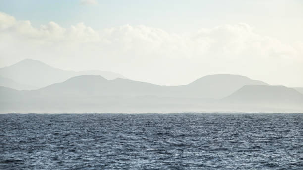 istock Mountain range in mist in the background and the Atlantic Ocean in the foreground. 1073220174