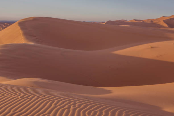 istock Magic hour at Sahara desert sandy dunes 1073222386