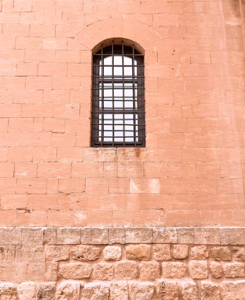 istock Old historical window on the wall 1073224594