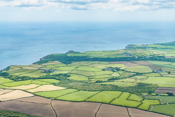 Aerial views over the Cornish Coastline at Lamorna Cove Aerial views over the Cornish Coastline at Lamorna Cove lamorna cove stock pictures, royalty-free photos & images