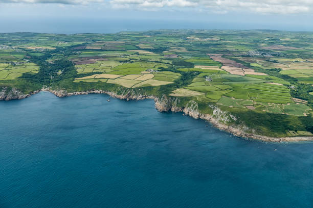 Aerial views over the South Cornish Coast including Lamorna Cove Beach. Aerial views over the South Cornish Coast including Lamorna Cove Beach. lamorna cove stock pictures, royalty-free photos & images