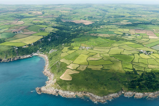 Aerial views over the South Cornish Coast including Lamorna Cove Beach. Aerial views over the South Cornish Coast including Lamorna Cove Beach. lamorna cove stock pictures, royalty-free photos & images