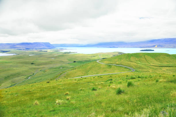 istock Road, lake and green 1073226272