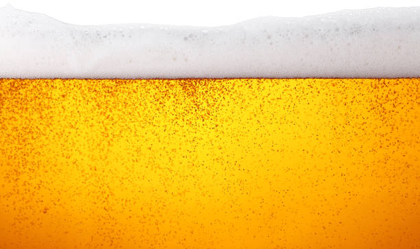 istock Close up background of beer with bubbles in glass 1073228306