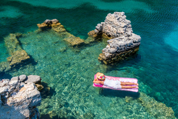 istock Woman is lying on the sea bed. 1073232802