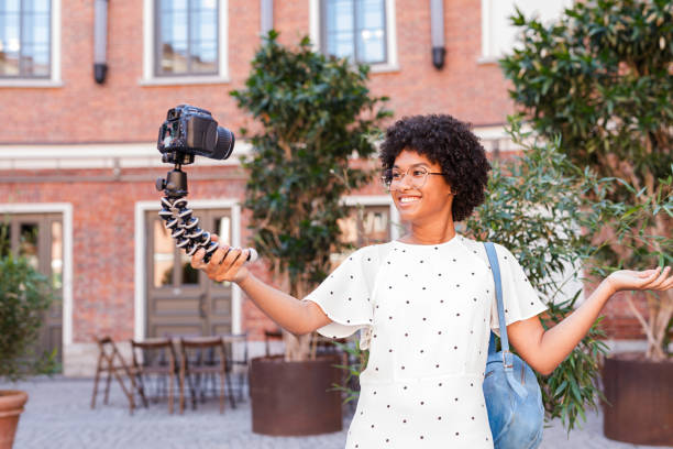 istock Happy woman shooting video content for her blog 1073237182
