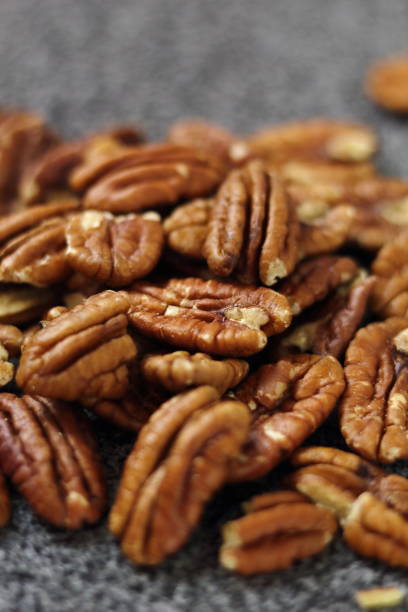 istock Pecan Nut Halves on Granite Slab 1073238770
