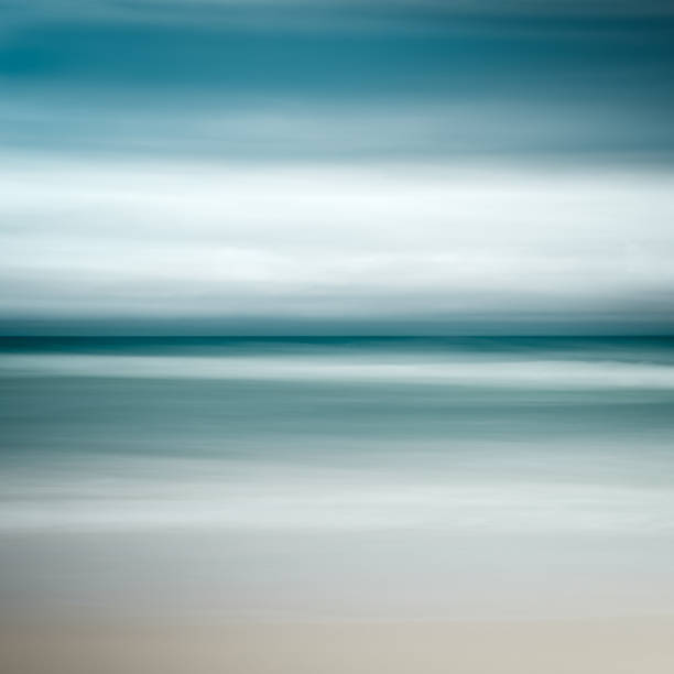 istock Empty sea and beach background with copy space, Long exposure, blur motion blue abstract vintage tinted gradient background 1073238920