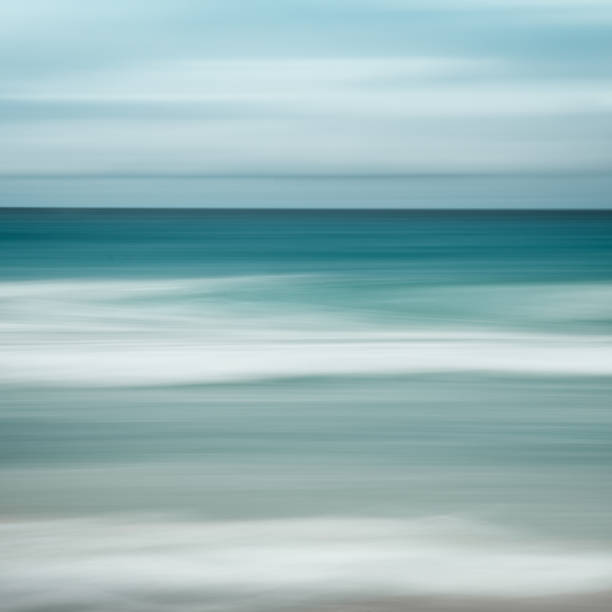 istock Empty sea and beach background with copy space, Long exposure, blur motion blue abstract vintage tinted gradient background 1073239146