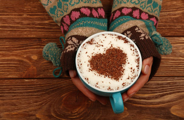 istock Woman hands hold full latte cappuccino coffee cup 1073241872